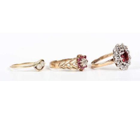 A 9ct gold, garnet and diamond oval cluster ring, Birmingham 1979, ring size approx R, a 9ct gold, ruby and diamond nine ston
