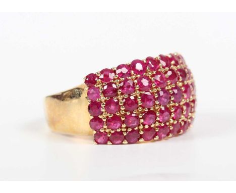 A gold and treated ruby ring in a five row bombé cluster design, detailed ‘585’, weight 6.5g, ring size approx N1/2.