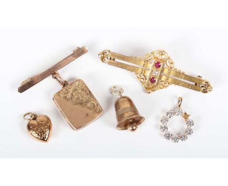 A late Victorian 15ct gold, ruby and diamond three stone bar brooch, Birmingham 1897, weight 3.6g, width 4.6cm, a 9ct gold re