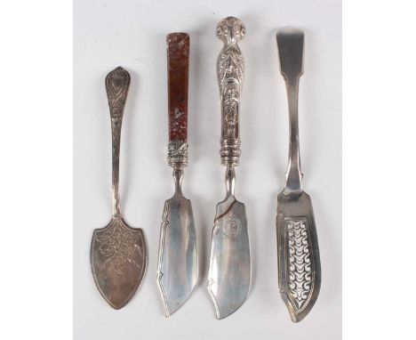An early Victorian silver butter knife, the handle with ram's mask terminal above a figure, the blade crest engraved, London 