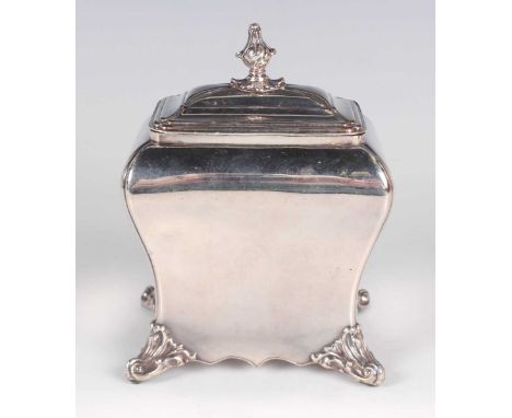 A mid-18th century Sheffield plate tea caddy of bombé form with rectangular stepped cover and foliate finial, on cast foliate