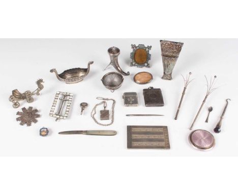 A small group of silver, including a George III silver tapestry needle inscribed 'A.M 1762', length 7cm, a late Victorian pos