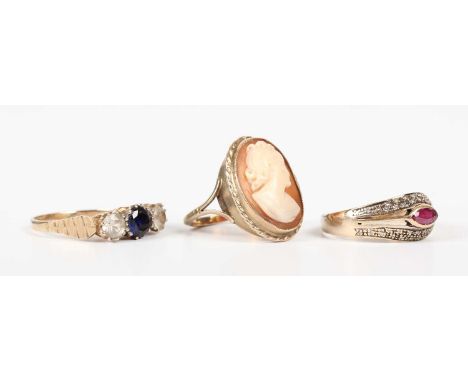 A gold, ruby and diamond ring, mounted with a marquise shaped ruby at the centre, detailed ‘585’, weight 2.9g, ring size appr