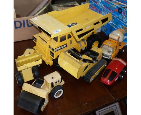 Tonka caterpillar dumper truck, a Tonka loader, bulldozer, road roller, car and cement lorry