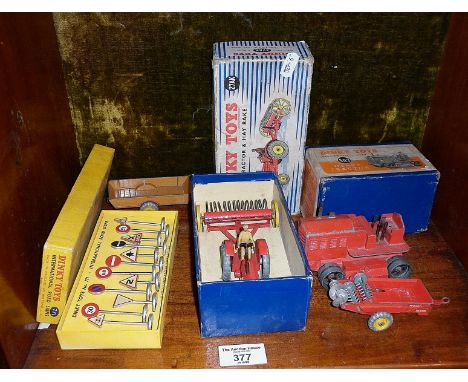 Dinky Toys farm tractor and hay rake 27AK with two trailers, Dinky Toys International Road signs, No. 771, and Heavy Tractor 