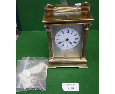 19th c. French brass repeating carriage clock with two train movement striking on a gong, the case having Corinthian columns,