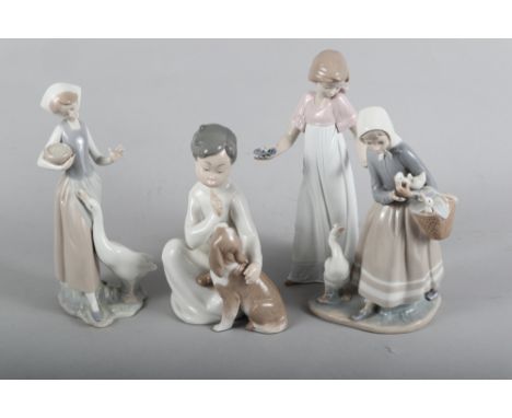 Three Lladro figure groups, girl with basket of ducklings, 9" high, girl with goose, 9 1/2" high, and boy with puppy, 7 1/2" 