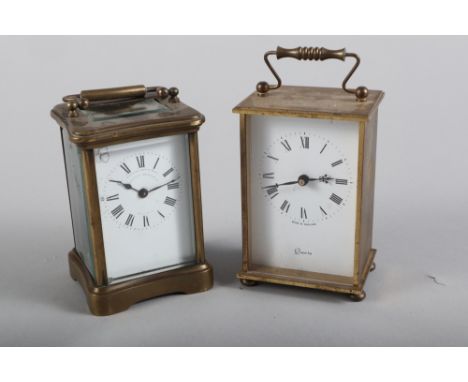 A French brass cased carriage clock with white enamel dial and a modern Kienzle carriage clock 