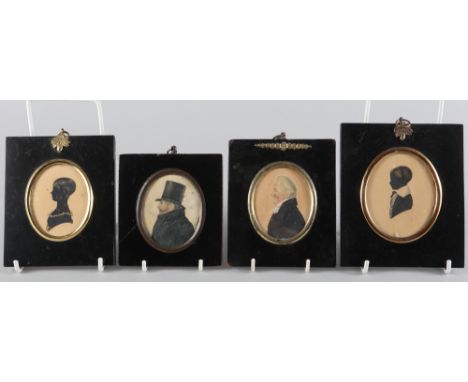 Two 19th century portrait miniatures of gentlemen, in ebonised frames, and a pair of silhouette portraits of a young boy and 