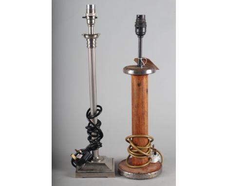 A thread bobbin, now a table lamp, 18" high, and a reeded column table lamp, 19" high 
