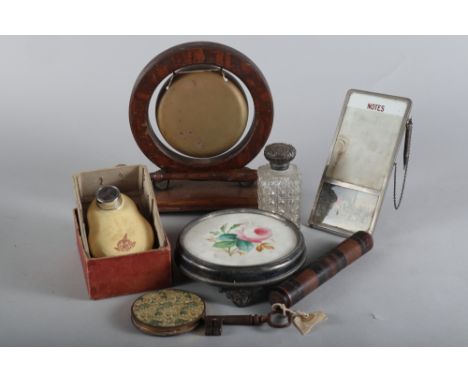 A square silver topped scent bottle, a kettle stand, in silver plated frame, a wooden dinner gong, a clockwork razor, a compa