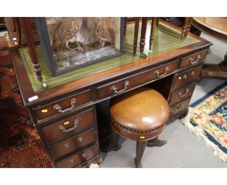 A mahogany double pedestal desk with tooled green leather top, fitted nine drawers, on bracket feet, 48" wide x 24" deep x 30
