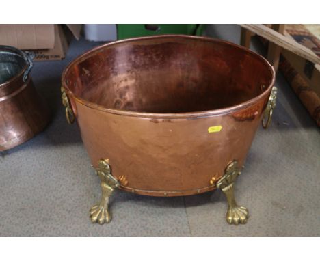 An oval copper coal bin, on brass paw feet, 17" long, and a pierced silvered metal pendant lamp shade, decorated cabochons 
