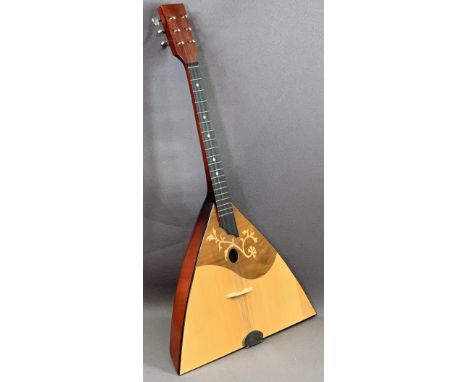MUSICAL INSTRUMENTS - a balalaika with label 'The Ozark for Stentor Music Company', six strings, 68cms L