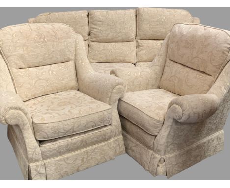 THREE PIECE LOUNGE SUITE in beige floral upholstery, 96cms H, 215cms W, 93cms D (the sofa) and two armchairs, 96cms H, 97cms 