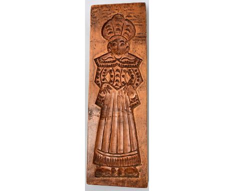 Holzmodel, 19. Jh./ um 1900 Laubholz, geschnitztes Motiv einer Frau in Tracht. Moderner Wandhaken. 40 x 13 cm.  Baking model,