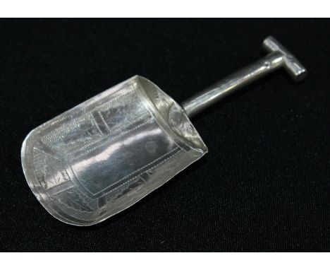 A George III silver novelty caddy spoon, as a shovel, bright-cut engraved and outlined with wriggle-work, 7.5cm long, Birming