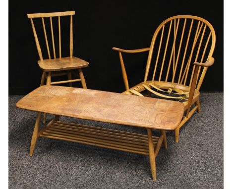 A 1960s Ercol open arm chair, 75cm high; a similar Ercol elm side chair, 79cm high; a similar elm top coffee table, 36cm high