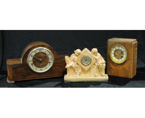 An Art Deco plaster clock, Happy Hours, 27cm wide; a Westmister chime mantel clock; another mantel clock (3) 