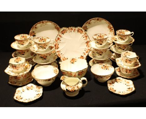 A Staffordshire Radfordian Imari palette tea set for twelve, comprising twelve teacups, saucers and tea plates, pair of sandw