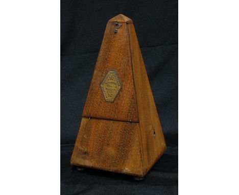 A late 19th century French walnut metronome, c.1900 