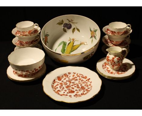 A Coalport tea set for six, printed in red on a white ground; a large Royal Worcester Evesham pattern fruit bowl 