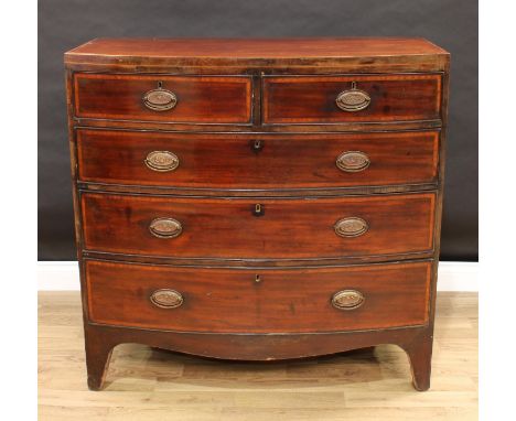 A George IV mahogany bow-fronted chest, of two short and three long graduated cockbeaded drawers, oval brass handles, satinwo