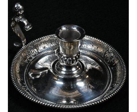 A Victorian silver chamber stick, half-fluted campana sconce, figural S-scroll handle, domed base with beaded border and chas