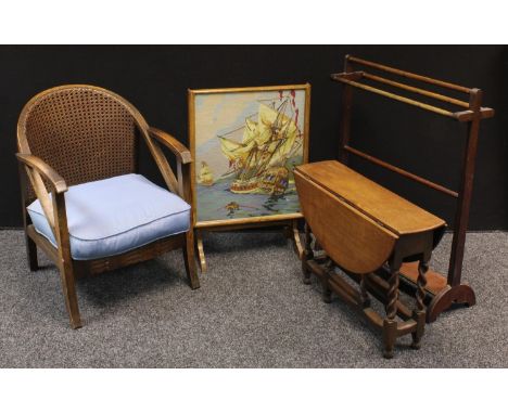 A 20th century oak drawing room clue chair, cane back; 72cm; an oak drop leaf table, barley twist supports; a mahogany towel 