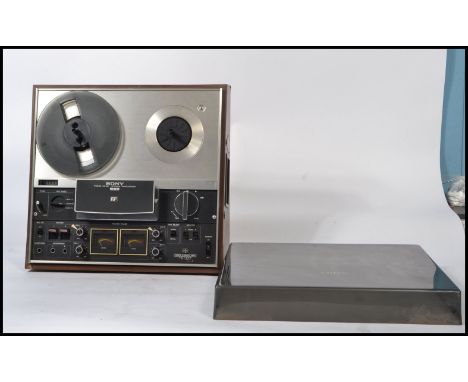 A retro 20th century Sony TC-377 three head stereo reel to reel tape recorder / tapecorder