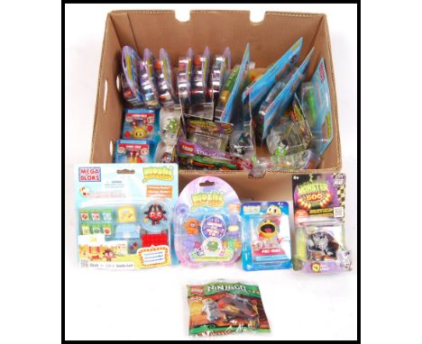A collection of children's carded action figures/ sets to include; 5x Mega Bloks Moshi Monsters set, 4x Pac Man &amp; the Gho