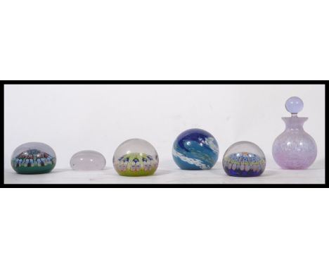 A collection of vintage 20th century studio art glass paperweights to include millefiori cane examples along with a Caithness