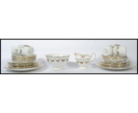 A vintage early 20th century Edwardian bone China chintz pattern&nbsp; tea service consisting of tea cups, saucers, side plat