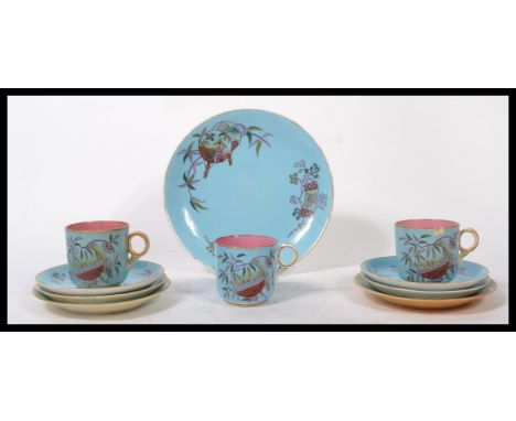 A 19th century Victorian Chinoiserie Aesthetic movement part tea service having Asiatic floral sprays with bamboo handled mag