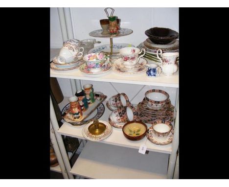 A quantity of vintage tea ware and character jugs, etc. - on two shelves 