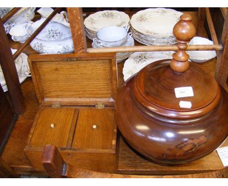 A turned wooden pot and cover, together with oak tea caddy 