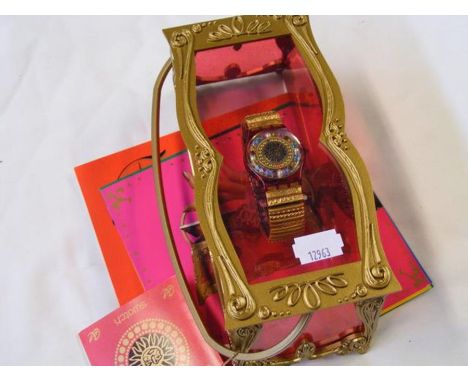 A Christian Le Croix Christmas Swatch watch in original case with box