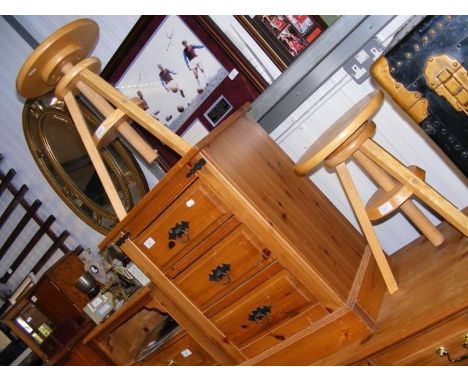 A pair of light wood stools 