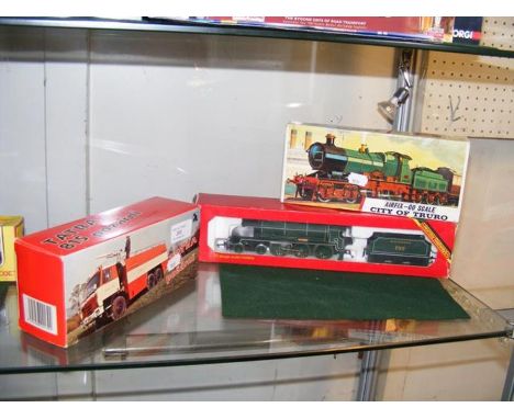 A boxed Hornby locomotive and tender together with an Airfix train and Fire Engine