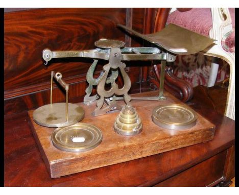 A set of antique postal scales with weights