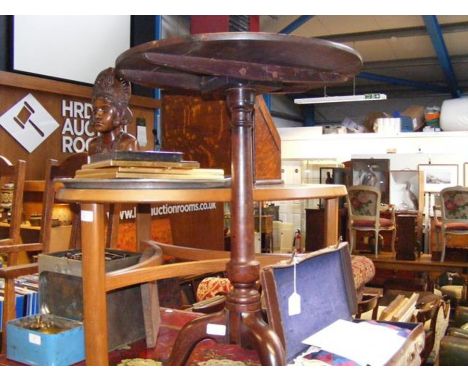 A circular occasional table on tripod support 