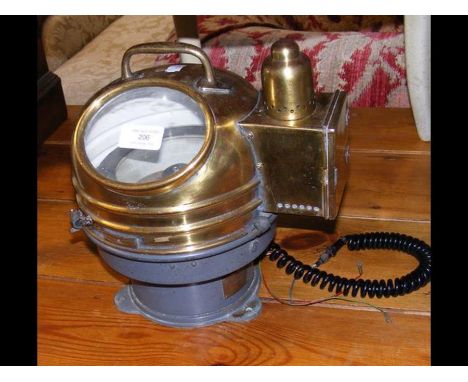 A ship's binnacle compass in brass case