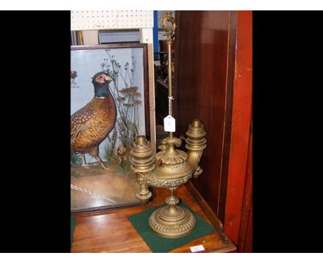 An unusual twin adjustable brass oil lamp - 65cms highCONDITION REPORTIn our judgement, condition of lot is good. There are n