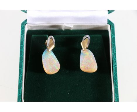 18ct yellow and white gold boulder opal and diamond set drop earrings. A well matched pair of random shaped Australian ironst