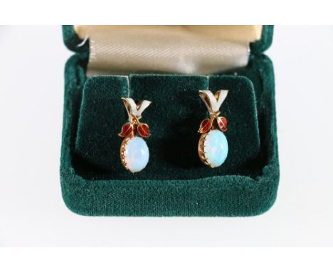 18ct yellow gold opal stud earrings with red and ivory enamel. Two oval Australian opal cabochons each portrait mounted in si