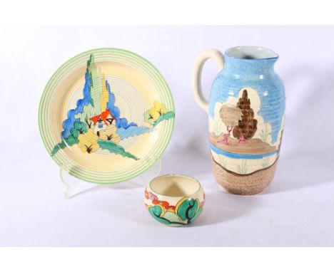 Clarice Cliff Bizarre pattern ribbed jug, 24cm a similar sugar bowl and a plate decorated with a cottage.  21cm (3) CONDITION