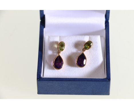 9ct yellow amethyst and peridot drop earrings. A well matched pair of 'Pear' shaped mixed cut amethyst's are suspended from a