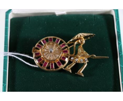 18ct yellow gold ruby and diamond set Bucherer rickshaw brooch watch. Limited edition 3/10. 43.73grms.