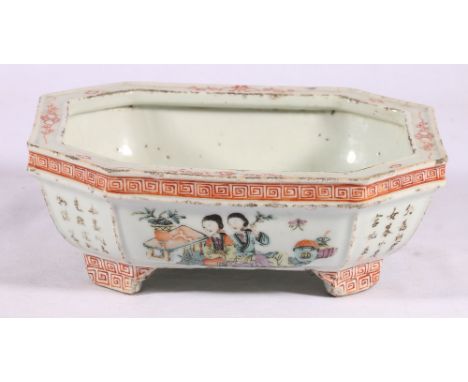 Chinese famille rose dish of octagonal form, raised on four supports decorated with four figure panels and calligraphy, 22.5c