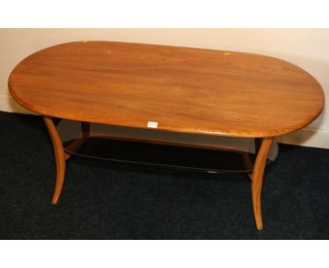 Ercol light oak coffee table with glazed shelf below raised on sabre legs. 114cm.